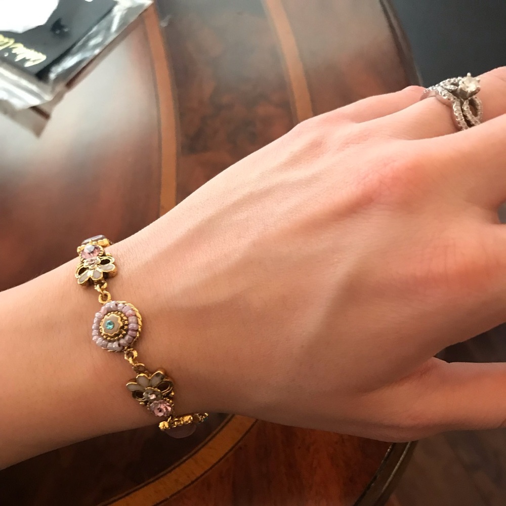 Women’s bracelet. Colors are purple, and teal.